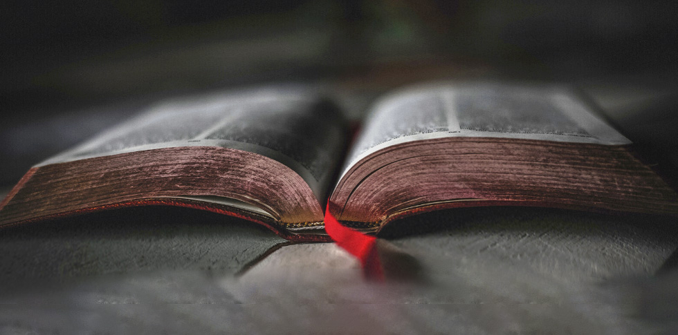 Open Bible with red ribbon, stock.adobe.com 